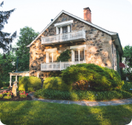 The exterior of a large cottage-style home. 